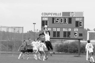 Coupeville goal keeper Joshua Adams makes a great leaping save in the second half of Thursday’s Cascade Conference game against King’s High School.