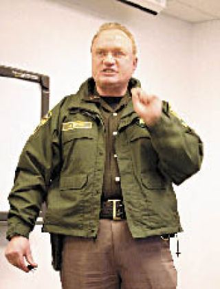 Sheriff Mark Brown discusses registered sex offenders at a community meeting in Oak Harbor Wednesday.