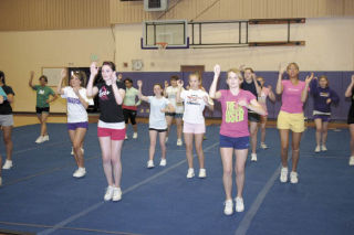 Forty student athletes strut their stuff and try to learn all the right moves during a practice session at spring tryouts for the Oak Harbor High School cheerleading team.