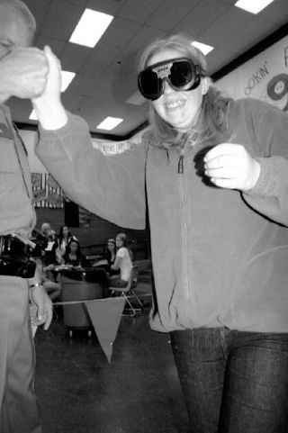 Trooper Norm Larsen helps freshman Kim Smith walk in a straight line. Smith was wearing “Fatal Vision” goggles