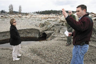 Oak Harbor City Engineer Eric Johnston describes to City Council member Beth Munns the dire conditions of a deteriorating 42-inch outfall near the west end of Windjammer Park during a March tour of city projects. The learned Civil Engineer Russ Pabarcus also helped explain the problems implicit with the 40-year-old pipe.