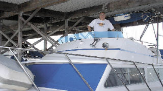On the bridge of “Dutch’s Legacy” at the Oak Harbor Marina