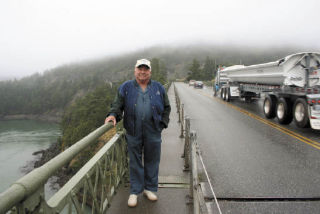 Fidalgo Island resident Dave Crawford stands at the expansion joint of one of the two spans of Deception Pass bridge. He said the extreme undulation that can be felt as a semi drives by is a clue that the bridge is aging and will need to be replaced someday.