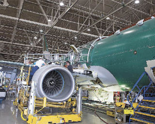 Boeing employees at its Renton plant had cause for celebration June 21 when two engines were installed on the Navy’s first P-8A Poseidon.