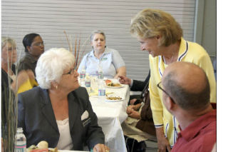Gov. Christine Gregoire greets Sen. Mary Margaret Haugen before her speech at the Coupeville High School Commons