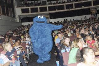 To everyone’s surprise Cookie Monster bounds off  the stage and greets the children in the audience during the performance of the Sesame Street Experience show on Saturday.