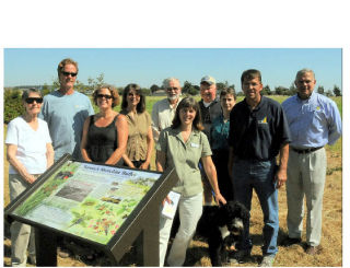 Here are a few of the many people who made the Freund Marsh trail a reality gathered for a dedication of the trail and new park benches