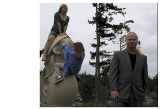 Don Lawler is the first artist commissioned by the city of Oak Harbor for public artwork. Here he stands next to his artwork titled “Release