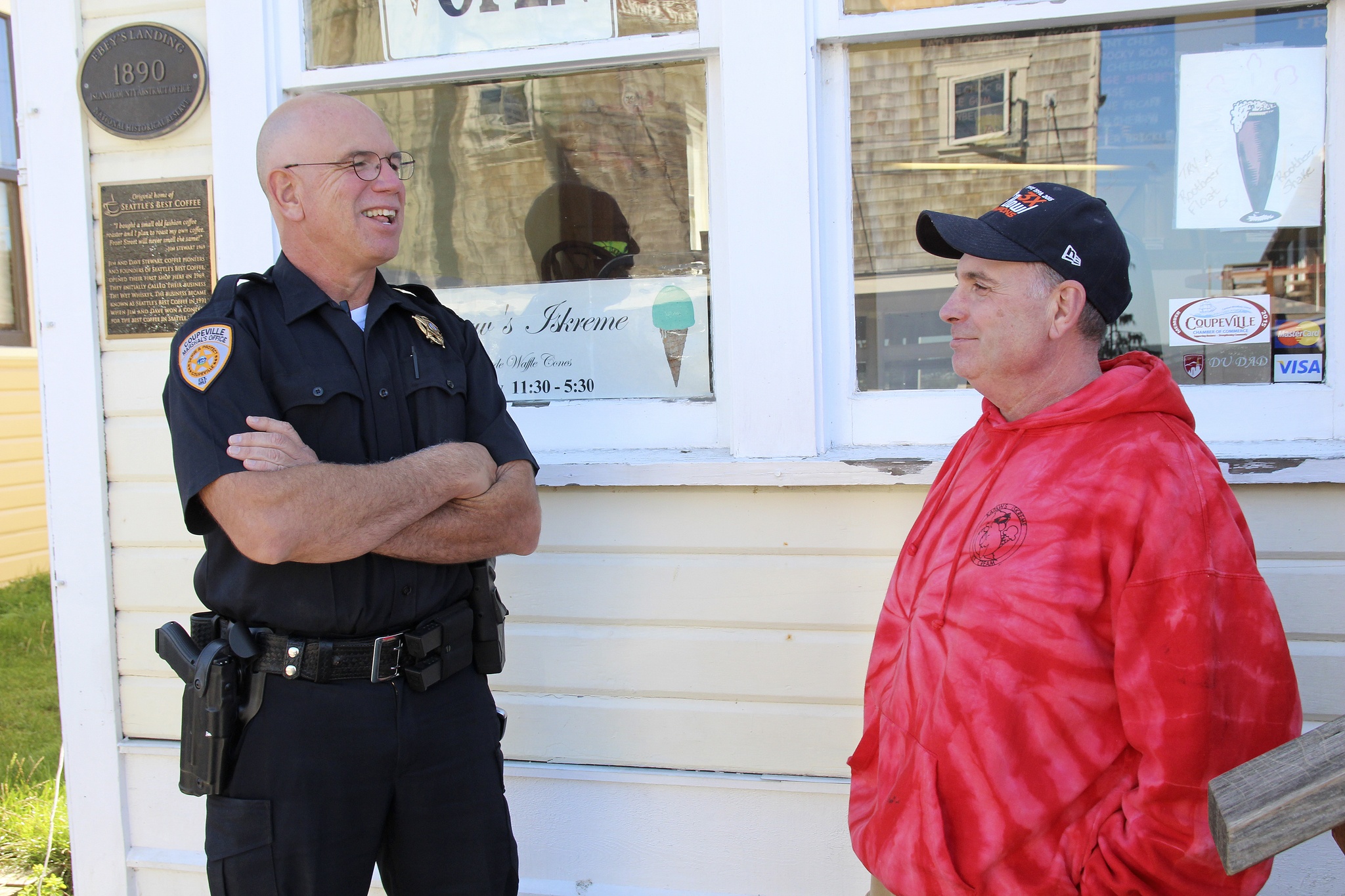 Coupeville Marshal Chris Garden chats with ice-cream-man Joel Norris on Front Street. One of Garden’s first priorities as new marshal was to get to know the business community.