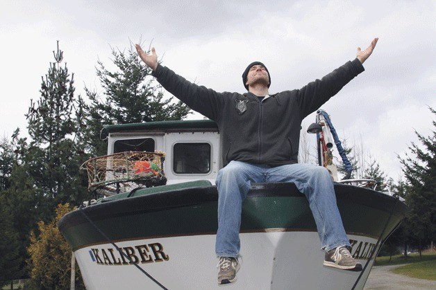 Gavin Keohane jokes around while sitting atop his boat