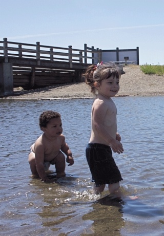 Zachary and Savannah Saho wade in the Windjammer Park lagoon.