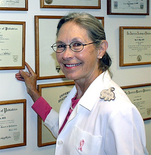 Dr. Jane Mays is retiring from Pediatric Associates of Whidbey Island where a wall displays her various awards and certificates.