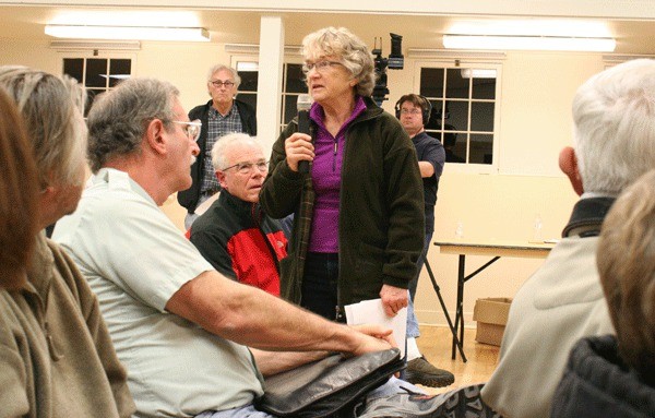 Jutta Wicker speaks to fellow residents at Tuesday’s presentation on the health effects of jet noise in Coupeville. The event was put on the Citizens of Ebey’s Reserve