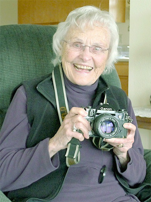 Oak Harbor’s Helen Chatfield Weeks shows her camera she used during her nearly 20-year career as a journalist. She is scheduled to be honored by the Island County Historical Society Awesome Autumn Auction scheduled Saturday