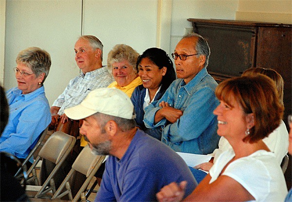 Albion Street residents and opponents of the Laurens Woods subdivision react to comments at a Coupeville Design Review Board meeting in which board members were told a housing development before them would move forward regardless of their vote.