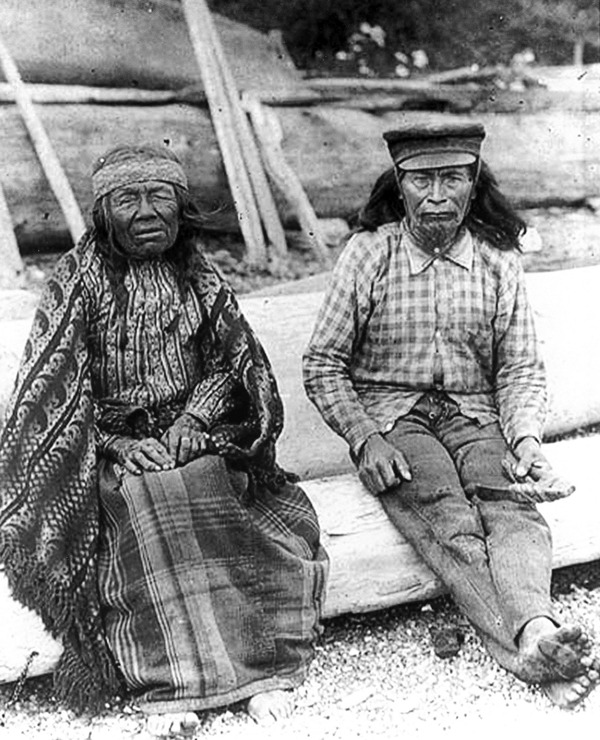 Tom the Canoe Maker and his wife pose for a photo some time around the turn of the century. The couple spent their whole lives living on Oak Harbor’s waterfront