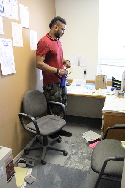 Real estate agent Michael Harris surveys his office after thieves ransacked the Tara Properties building. The thing he can’t replace is the service medal he earned in the Navy.