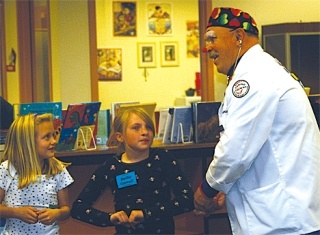 Doctor Stumble More (Blake Thomas) shows the K-Kids one of the magic tricks he uses to entertain patients at Whidbey General Hospital.