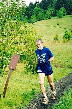 John Morelock runs the trails of a 50K in Oregon.
