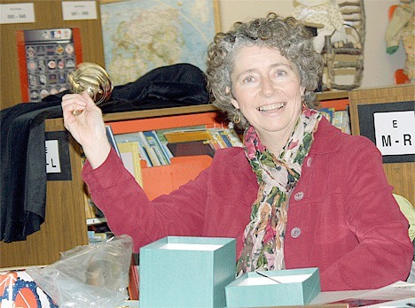 Outgoing Coupeville School Board member Cindy Van Dyk at her last meeting rings the ceremonial bell