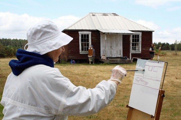 Janet Onffroy paints during her Plein Air class at Salmagundi Farms in Coupeville. A Whidbey native