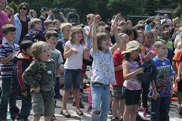 Students dance along with PTA members who performed “What Does the Fox Say” during the Broad View Elementary talent show.