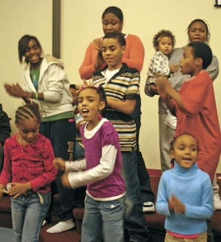 The New Unity Fellowship choir holds a Monday night rehearsal for Sunday’s Martin Luther King Jr. Day event. Among those practicing are Essence