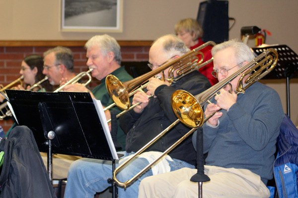 Members of the SeaNotes Big Band rehearse for their upcoming performance. The band’s director