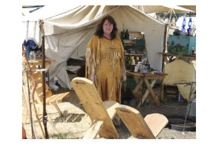Tammy Hollett’s camp at the Coupeville Rendezvous is well appointed with chairs for guests