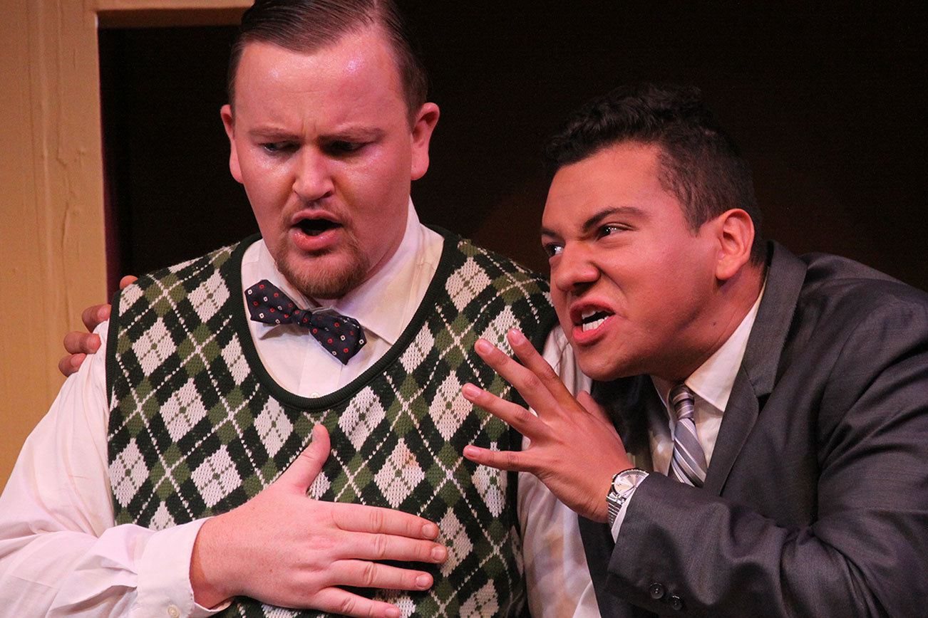 Eric George, who plays Robert, is having trouble ingesting the number of relationships juggled by his friend, Bernard, played by Duvan Andres Aaron Lopez, in the comedy, “Boeing Boeing.” Photo by Ron Newberry/Whidbey News-Times