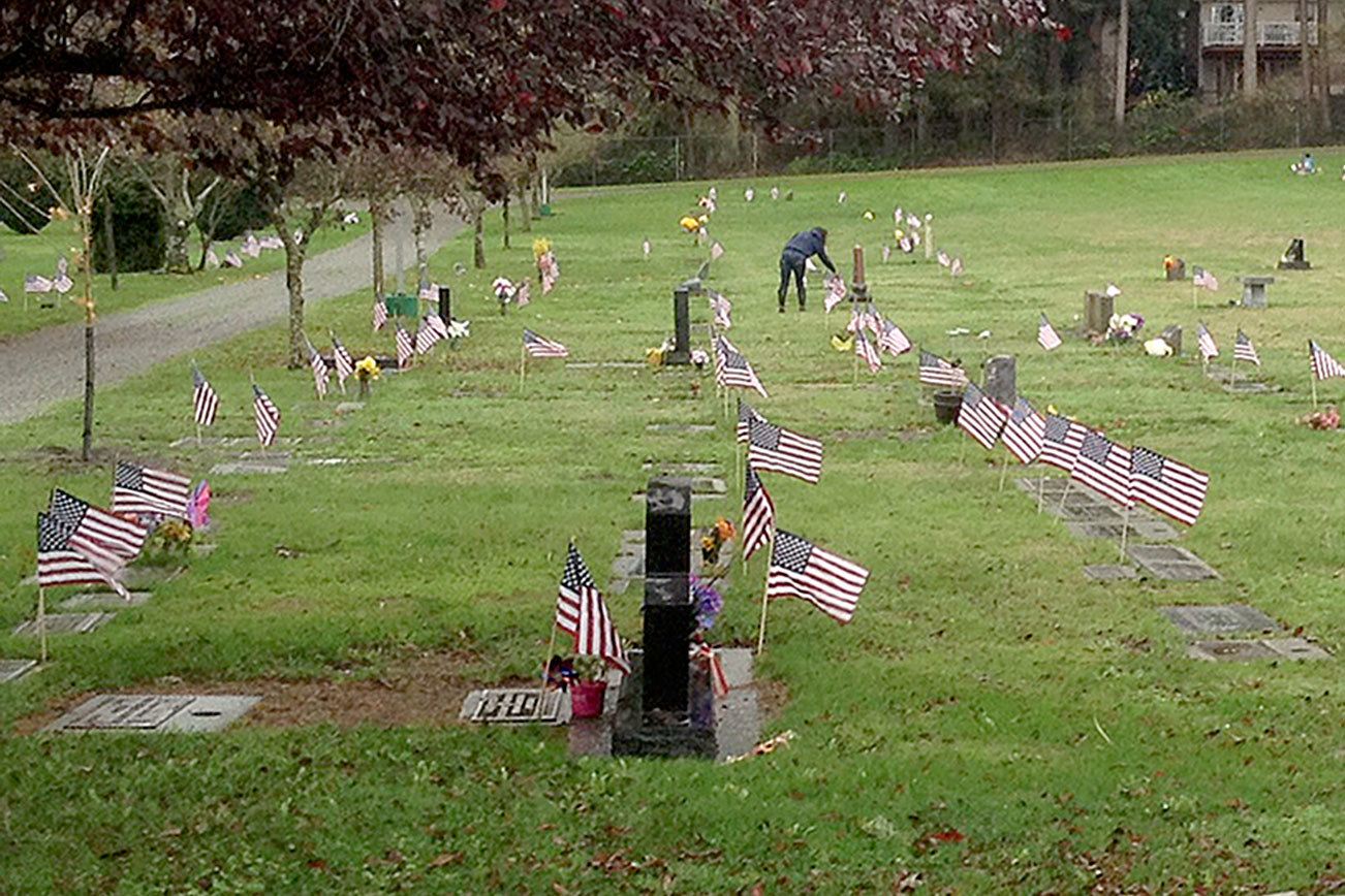 Oak Harbor NJROTC students place 1,500 flags on veterans’ graves