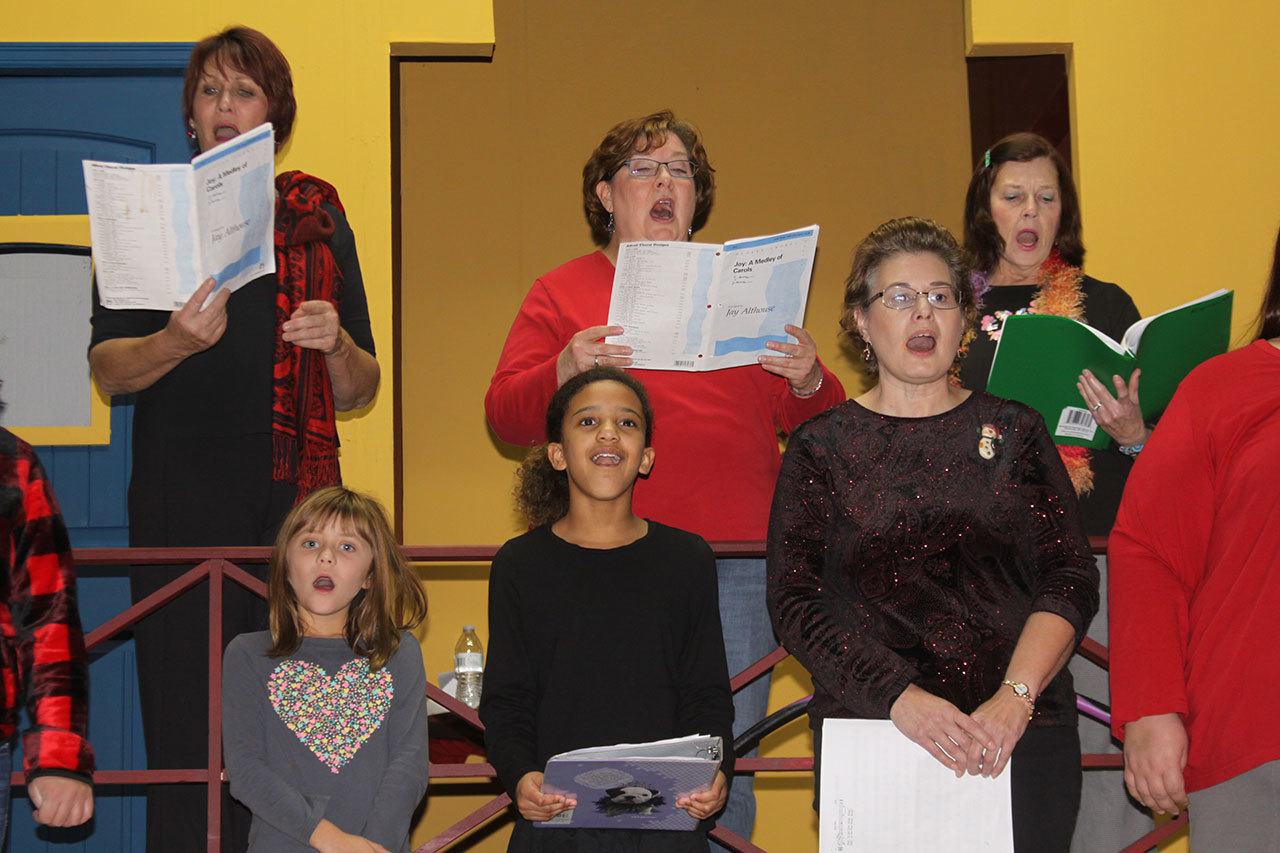 The chorus rehearses for &ldquo;Christmas at the Playhouse,&rdquo; Tuesday night at the Whidbey Playhouse in Oak Harbor. The musical revue starts Dec. 1. Photo by Ron Newberry/Whidbey News-Times