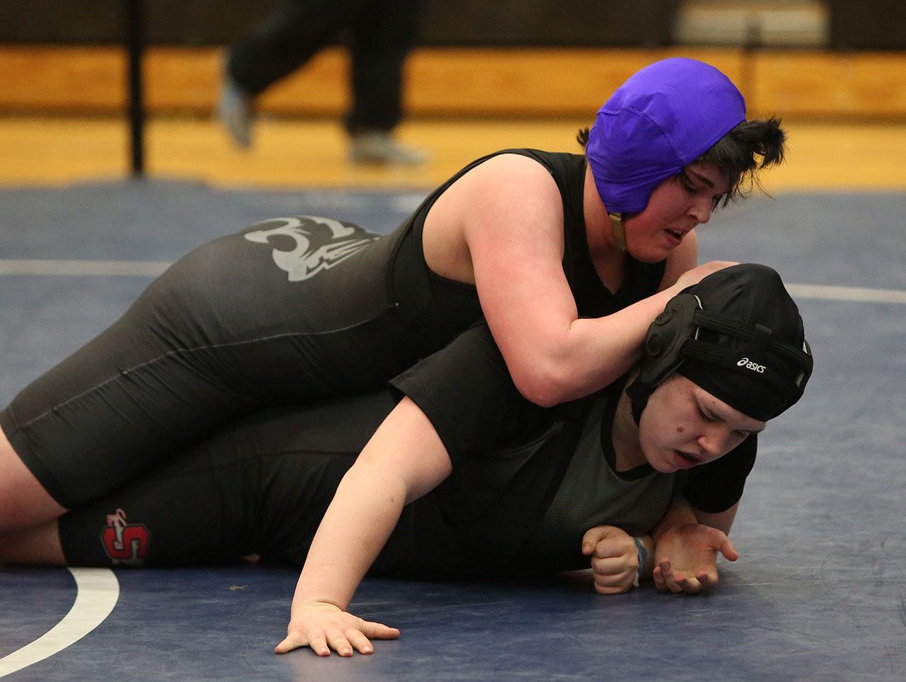 Meredith Bain, top, placed seventh in the state wrestling tournament last year. (Photo by John Fisken)