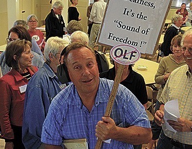 Ken Pickard, a leader of the anti-jet noise group Citizens of Ebey’s Reserve protests during a gathering at the Coupeville Rec Hall hosted by U.S. Rep. Rick Larsen. Pickard says a bogus post in his name on the Seattle Times website led to threats being made against him on a local Facebook page.