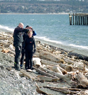 Diving instructor Jason Flake shows students Pauline and Bill Jones strong currents and winds at Keystone Jetty. The group came from Bellingham to dive.