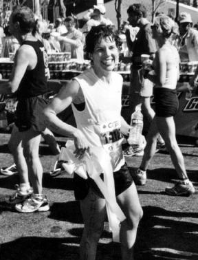 After crossing the finish line Sharon Jensen displays the yellow ribbon she wore while competing in the Boston Marathon last month.