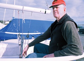 Staff photo / Jessie StenslandRecently retired councilman John LaFond sits aboard his racing sailboat