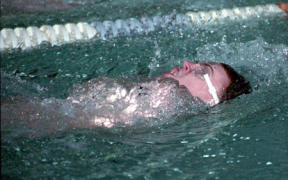 Junior Jason Hunter swims in the backstroke against Cascade Thursday night. He took first in the event