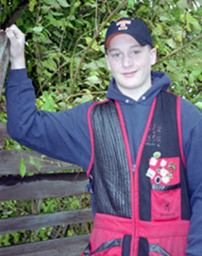 Kris Miller’s shooting jacket already boasts an array of badges awarded for his trap shooting abilities. At the age of 13