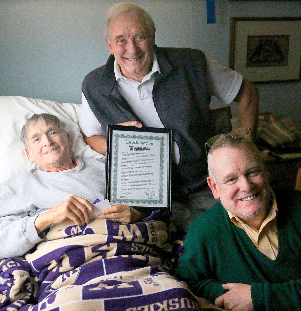 WNPA photo                                Presenting a proclamation to former Whidbey News Group publisher Wallie Funk, left, are Internship Coordinating Editor Frank Garred, center, and Wallie&rsquo;s son, Mark Funk.