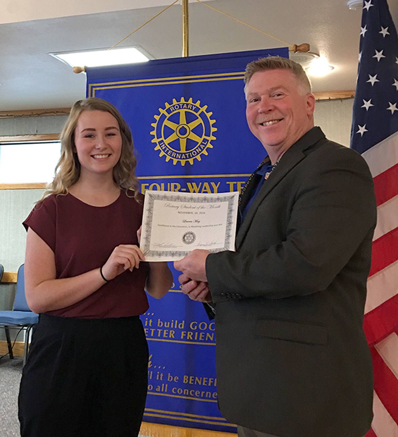 May receiving a student of the month certificate from Rotary Club president Greg Smith. Photo provided