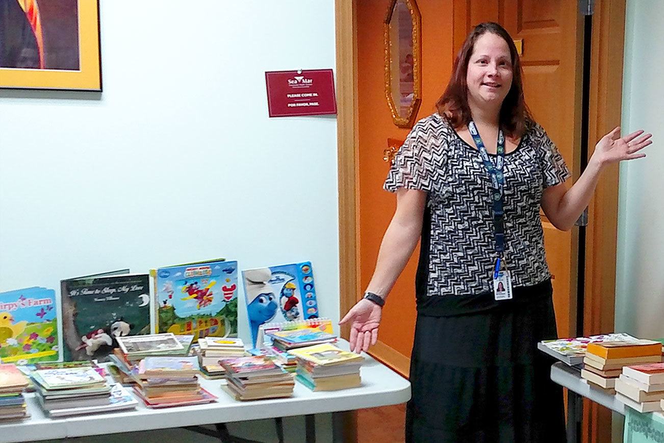 Sea Mar holding book drive for clients