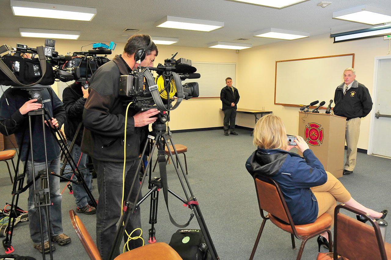 Island County Coroner Robert Bishop speaks to media during a press conference Dec. 22, 2016, at the North Whidbey Fire and Rescue station 25 in Oak Harbor, Wash., to discuss a tragic house fire that killed a woman and her two small chilren. Photo by Michael Watkins/Whidbey News-Times.