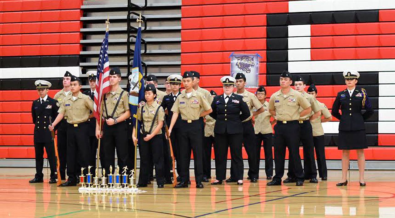 Representatives of Wildcat Battalion stand in front of the trophies they won in the season’s first competition last week. (Photo by Noel Pangilinan)