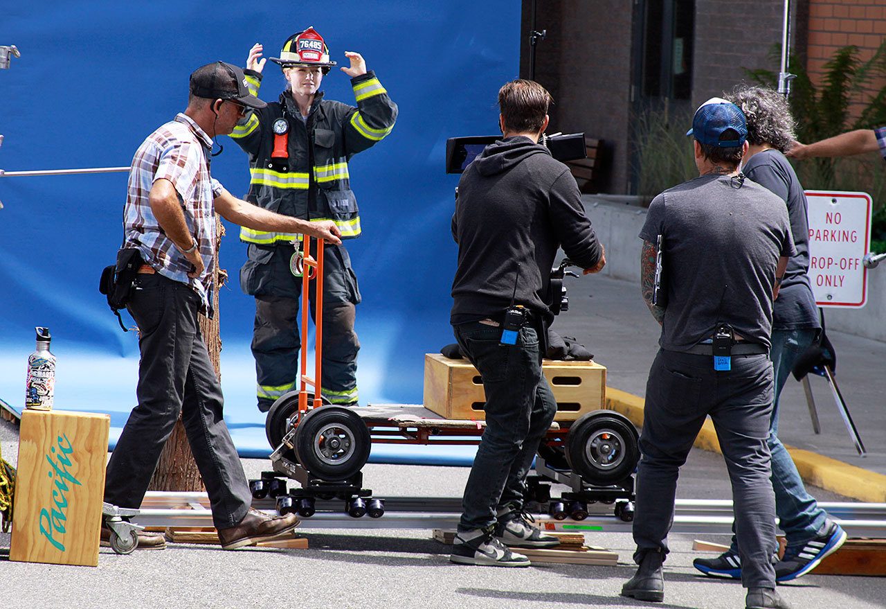 An Alaska Airlines commercial was shot on three Whidbey Island locations, including next to the Coupeville High School gym in late June. The building&rsquo;s brick wall was supposed to resemble a fire department. Photo by Ron Newberry/Whidbey News-Times