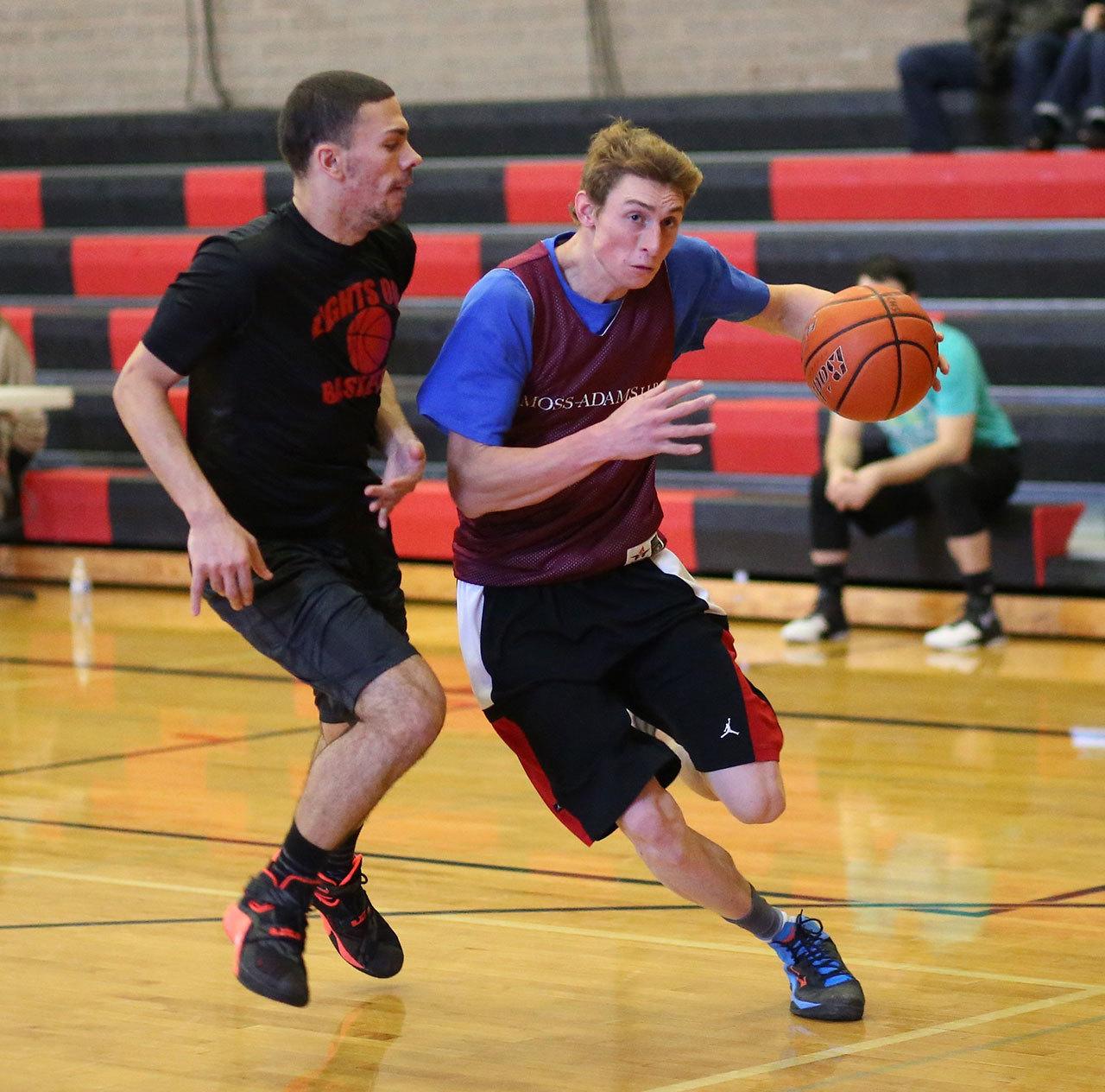 Former Oak Harbor High School player Chris Hailer takes the ball to the hoop. (Photo by John Fisken)