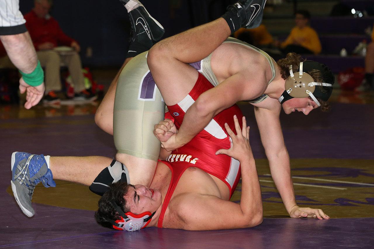 Sam Zook stacks up his opponent for a fall in the M-P match. (Photo by John Fisken)