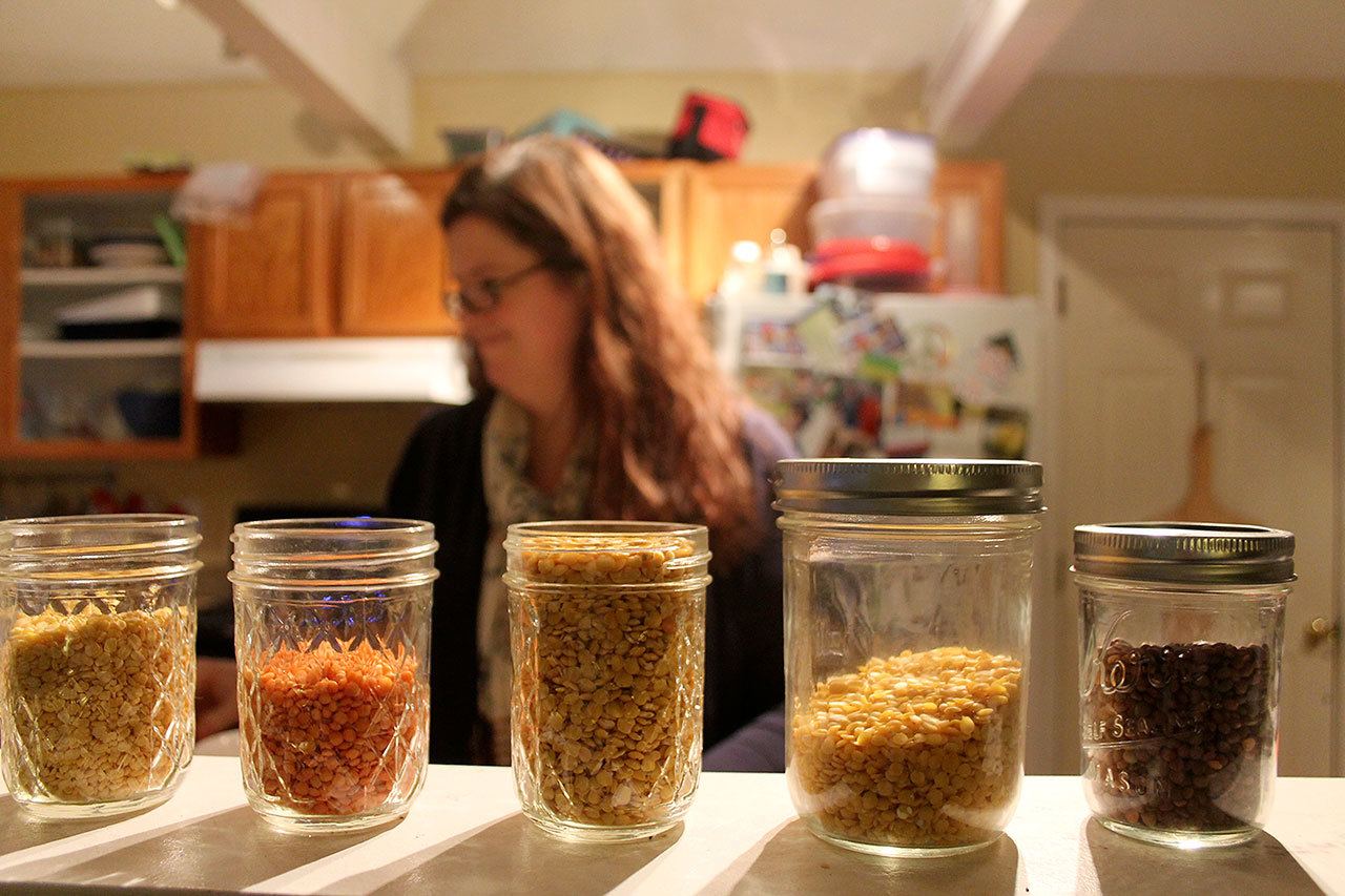 Kyle Jensen / The Record —                                Dietician Marcy Gaston pulls out a few mason jars of her lentil collection.