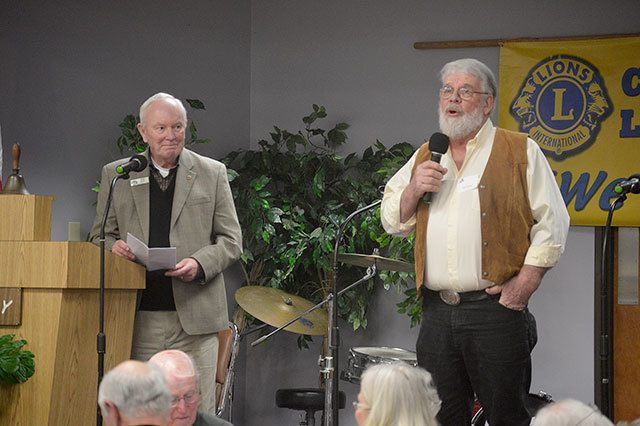 Lions Bob Clay, left, and Dale Sherman lead last year’s Coupeville Lions Scholarship Auction. File photo
