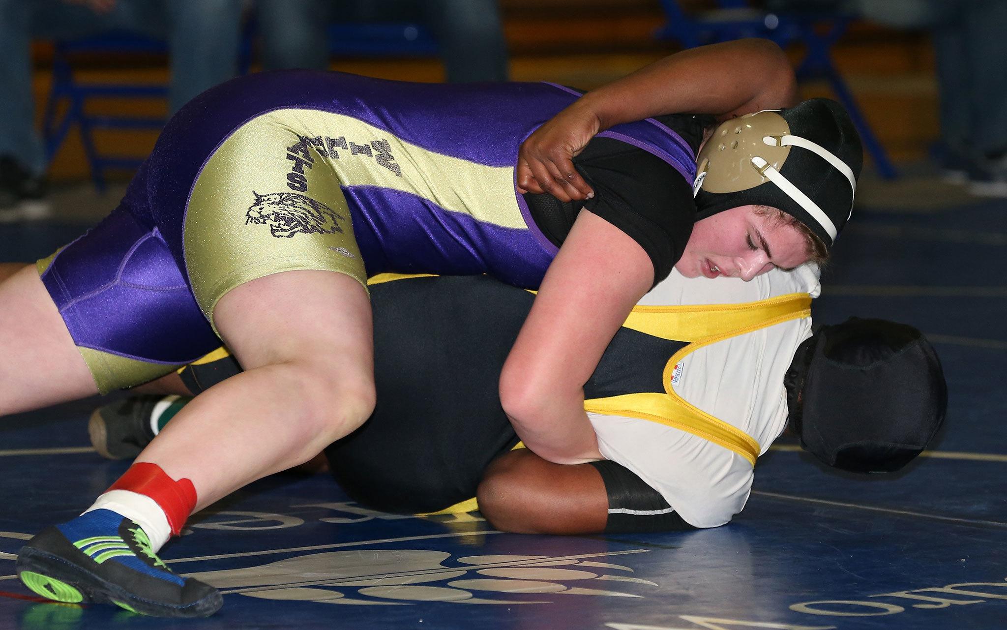 Meredith Bain tries to turn her opponent Saturday. The senior went on to win her bracket. (Photo by John Fisken)